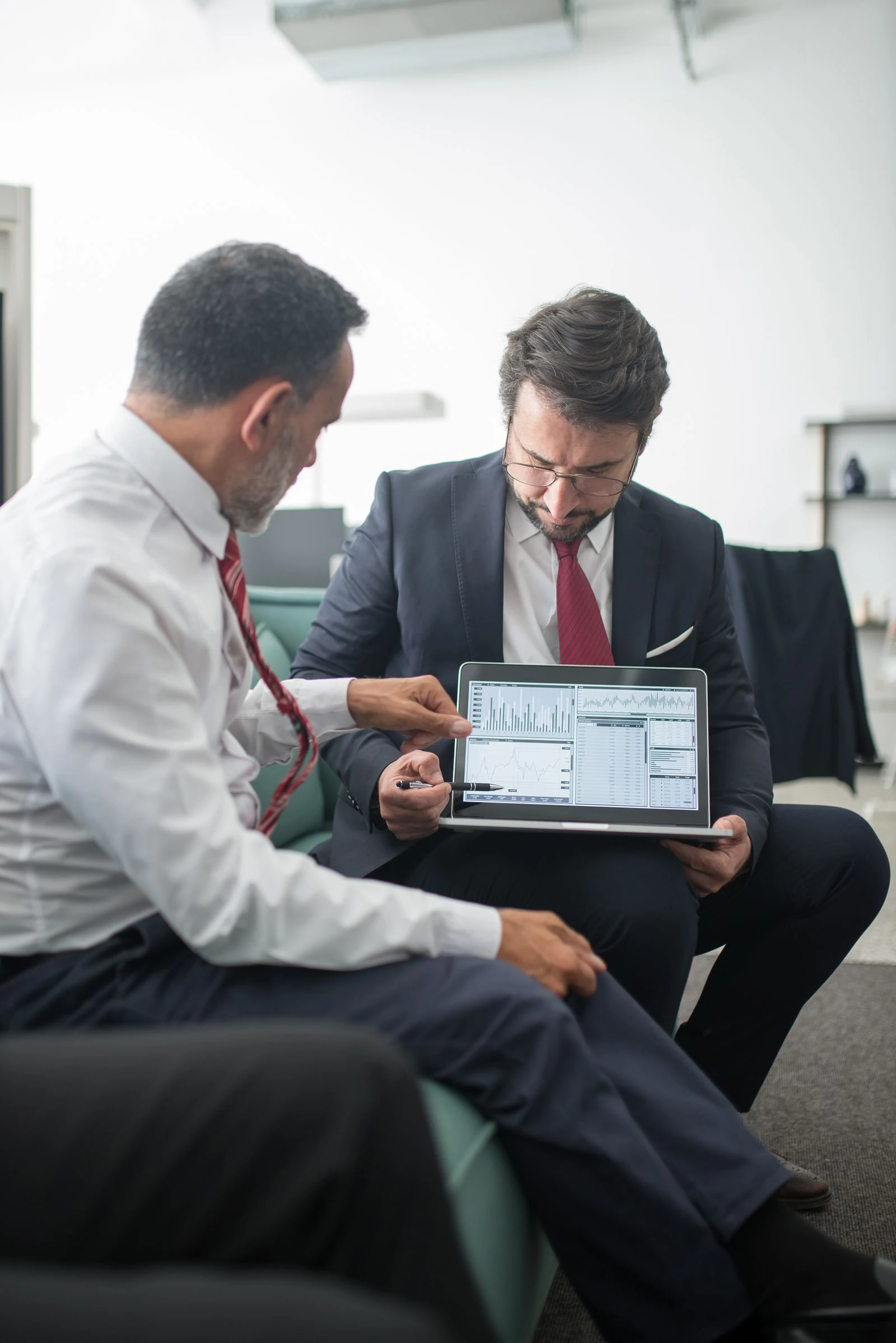 PPC agency team reviewing paid search performance on laptop