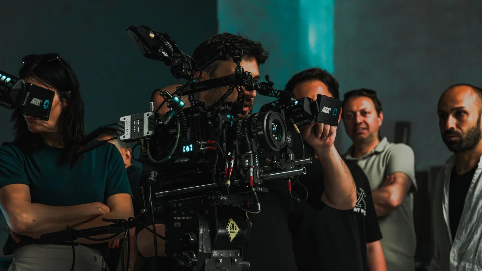 Film crew operating professional cinema camera on set