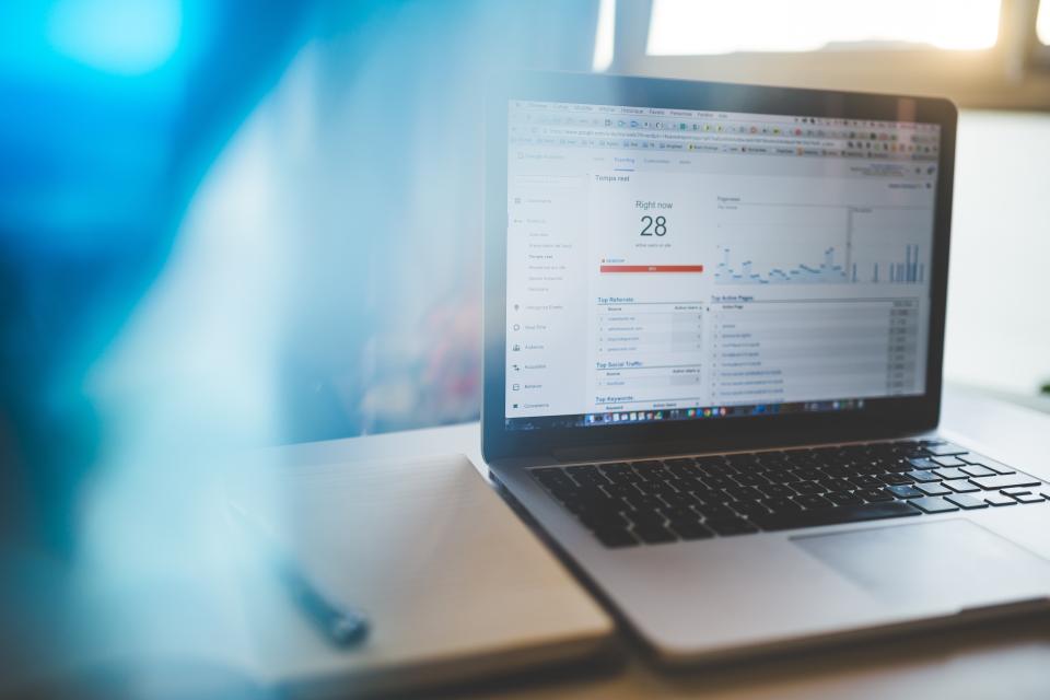 Laptop displaying an analytics dashboard with performance charts
