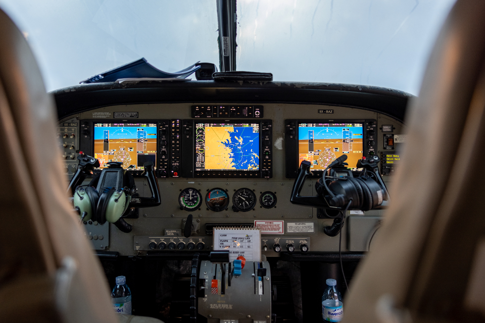 Aircraft cockpit with glass avionics displays