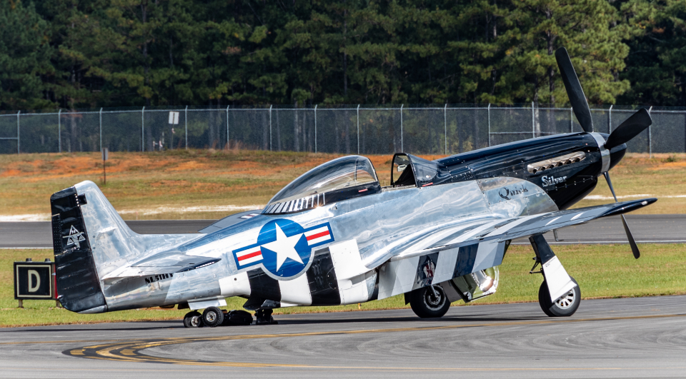 Military aircraft parked on a runway