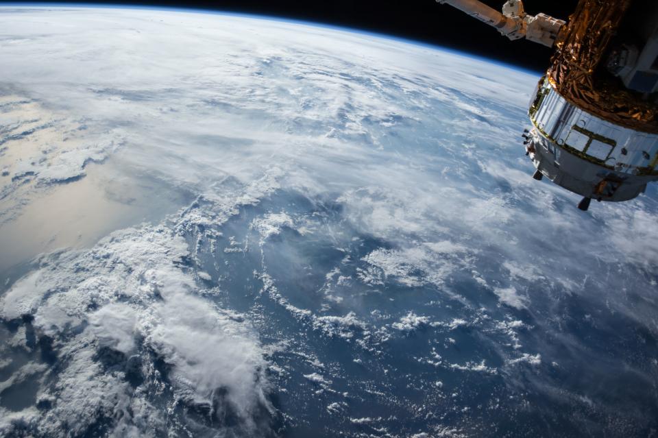Satellite hardware orbiting above the Earth