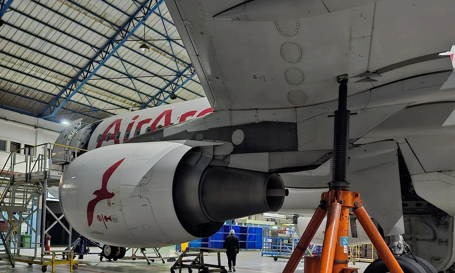 Aircraft engine maintenance inside hangar