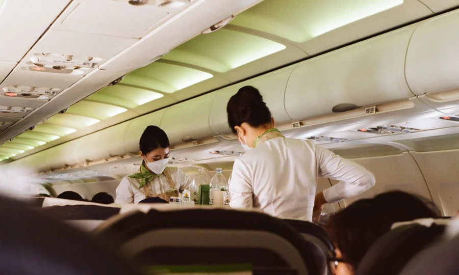 Airplane cabin crew serving passengers