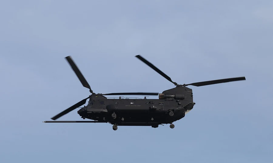 Helicopter flying against blue sky