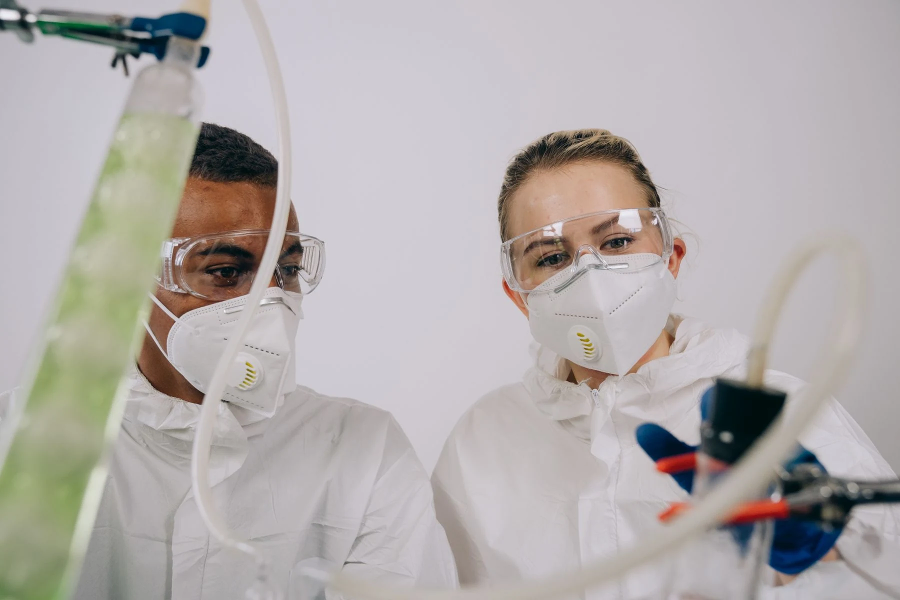 Researchers examining samples in a biotechnology laboratory