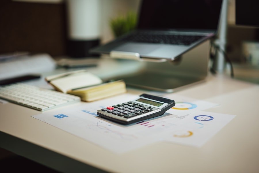 Calculator and laptop for bill payment tracking