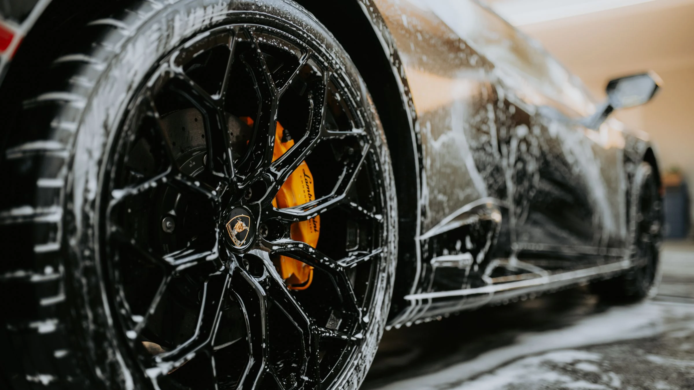 Premium car wash with foam and shine on a vehicle