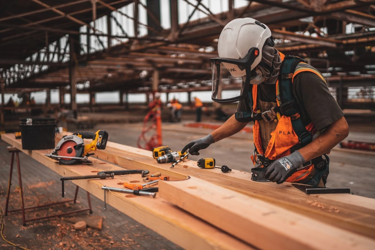 Carpenter using power tool on a custom wood project
