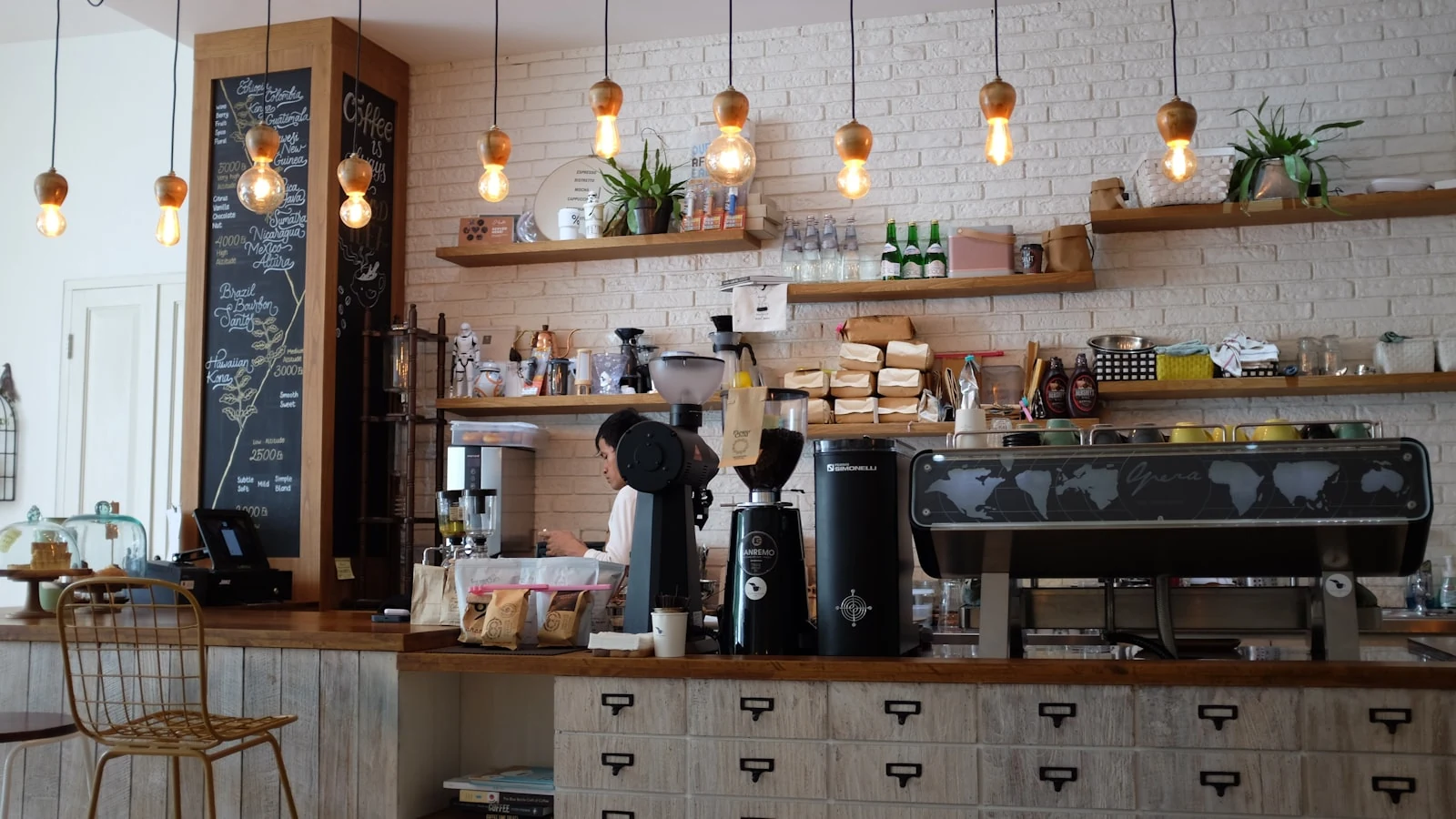 Warm coffee shop interior with seating and counter