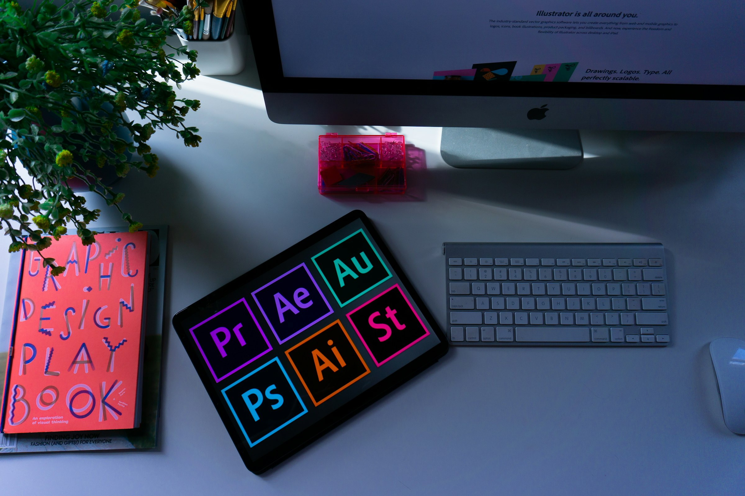 Logo and brand identity design sketches on a creative workspace