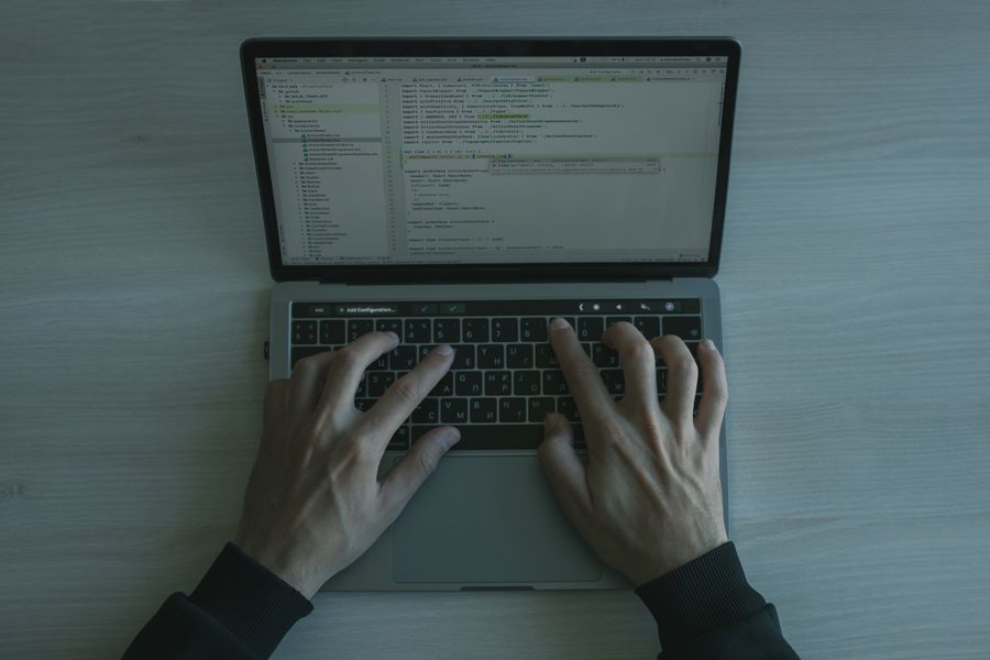 Security professional working on cybersecurity code