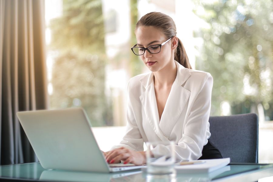 Professional founder working on laptop in modern office