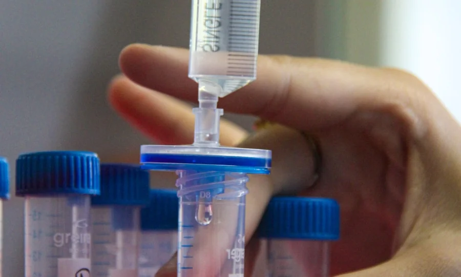 Researcher handling environmental field testing samples