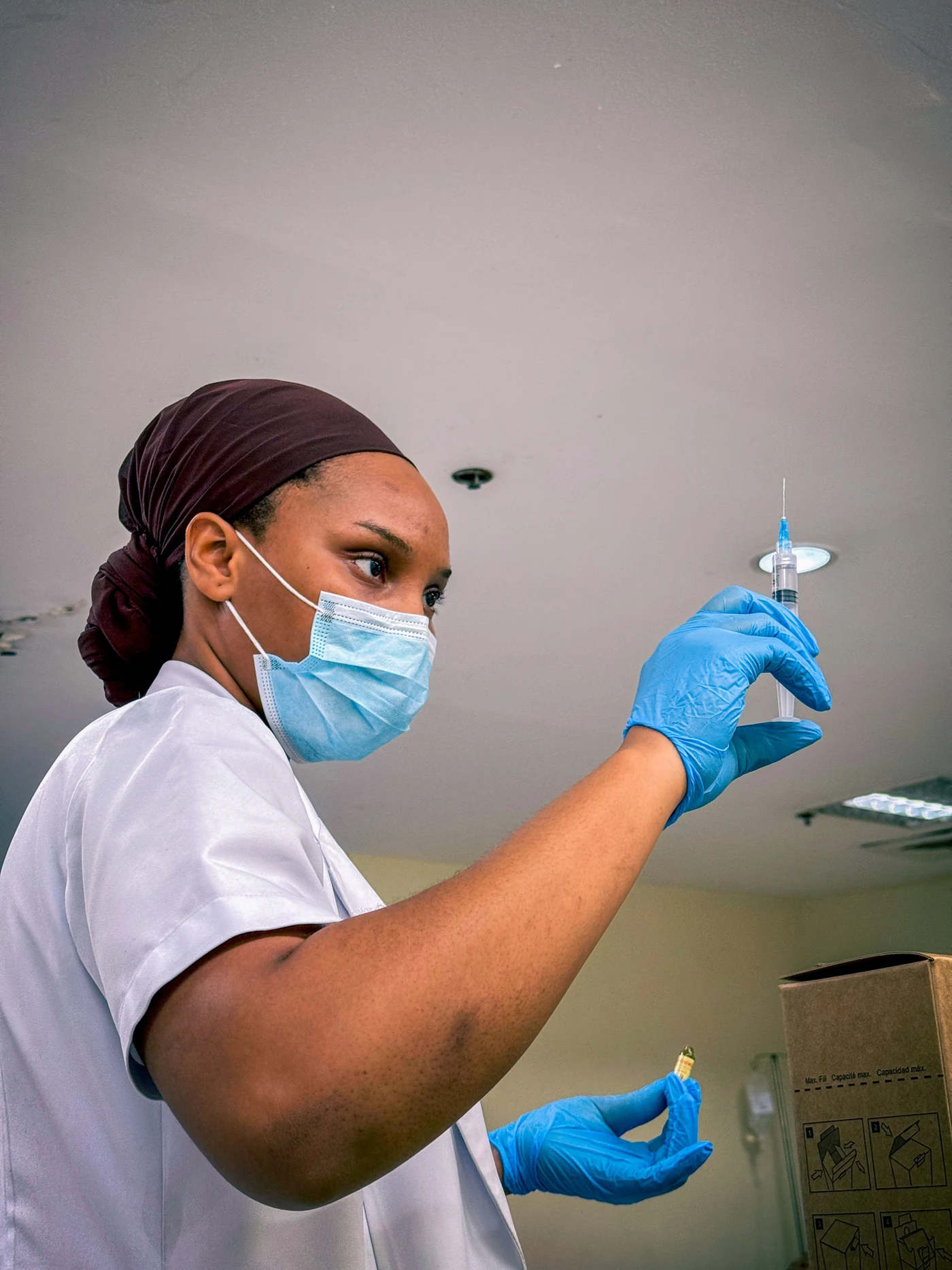 Healthcare worker preparing patient care at public health clinic