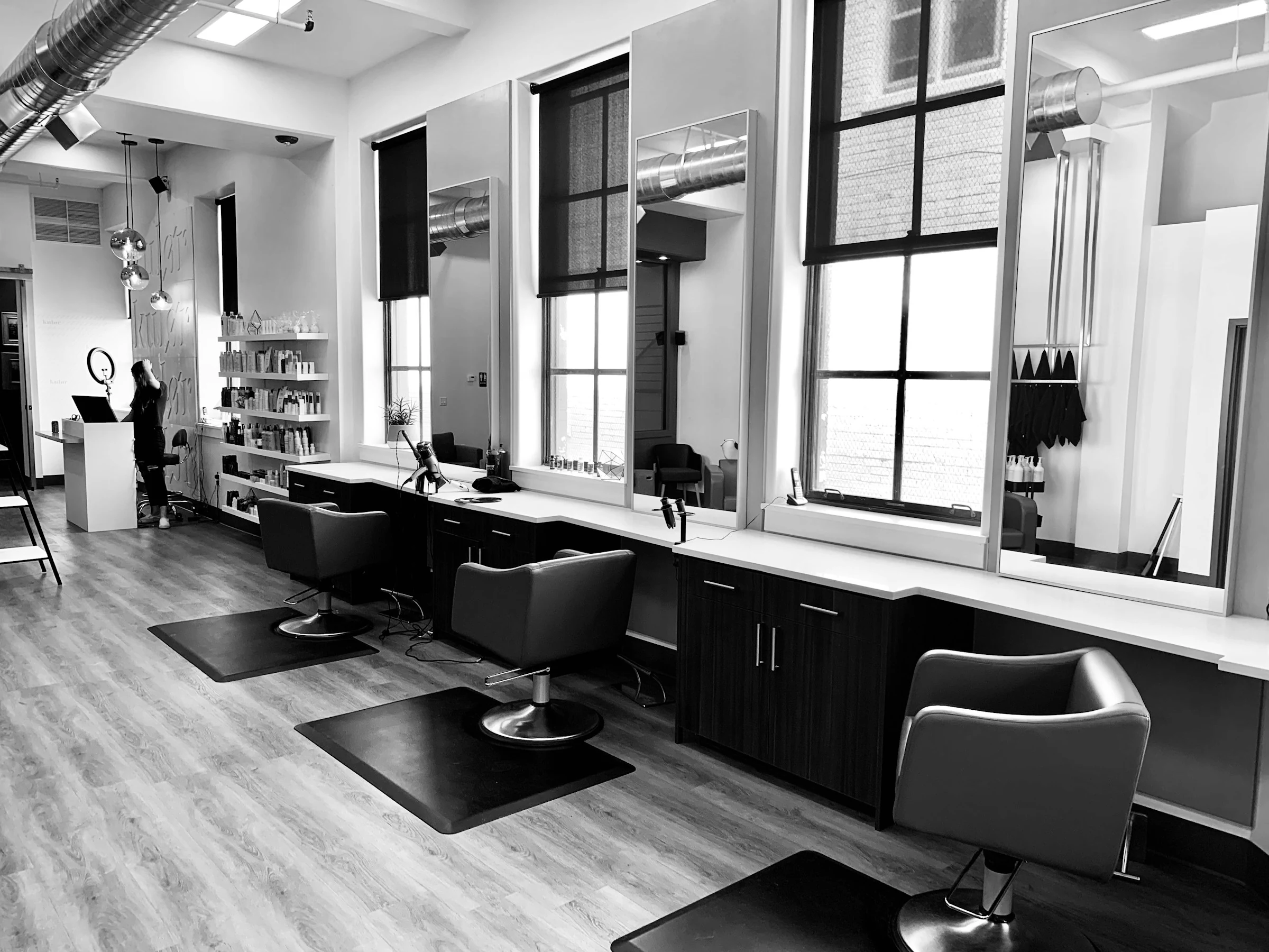 Premium hair salon stylist working with client