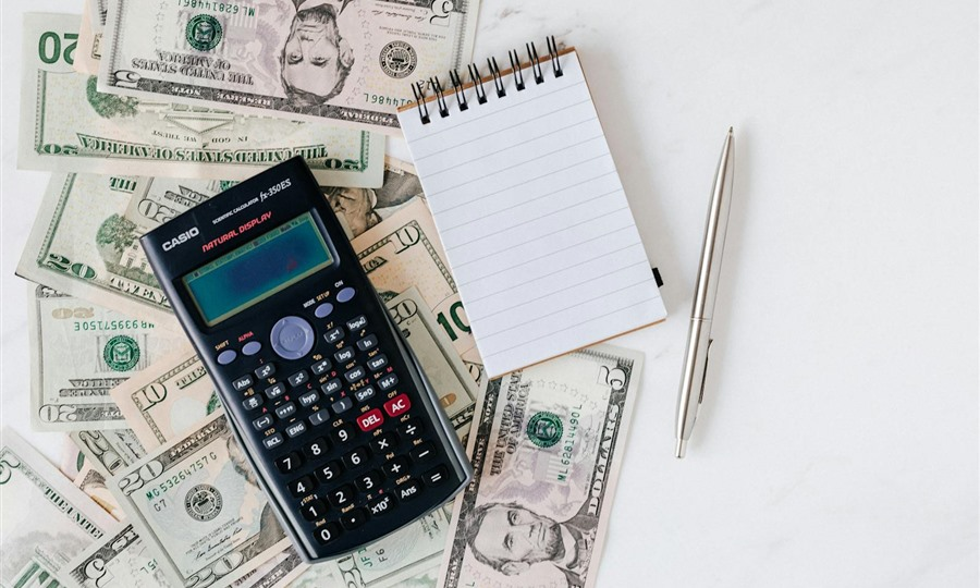 Independent financial advisor consulting with clients at desk