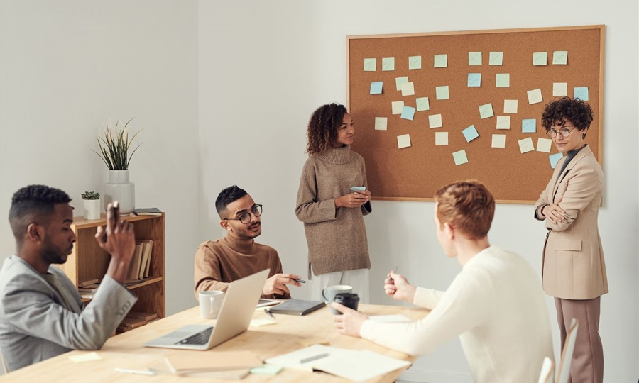 Private equity executives in corporate boardroom meeting