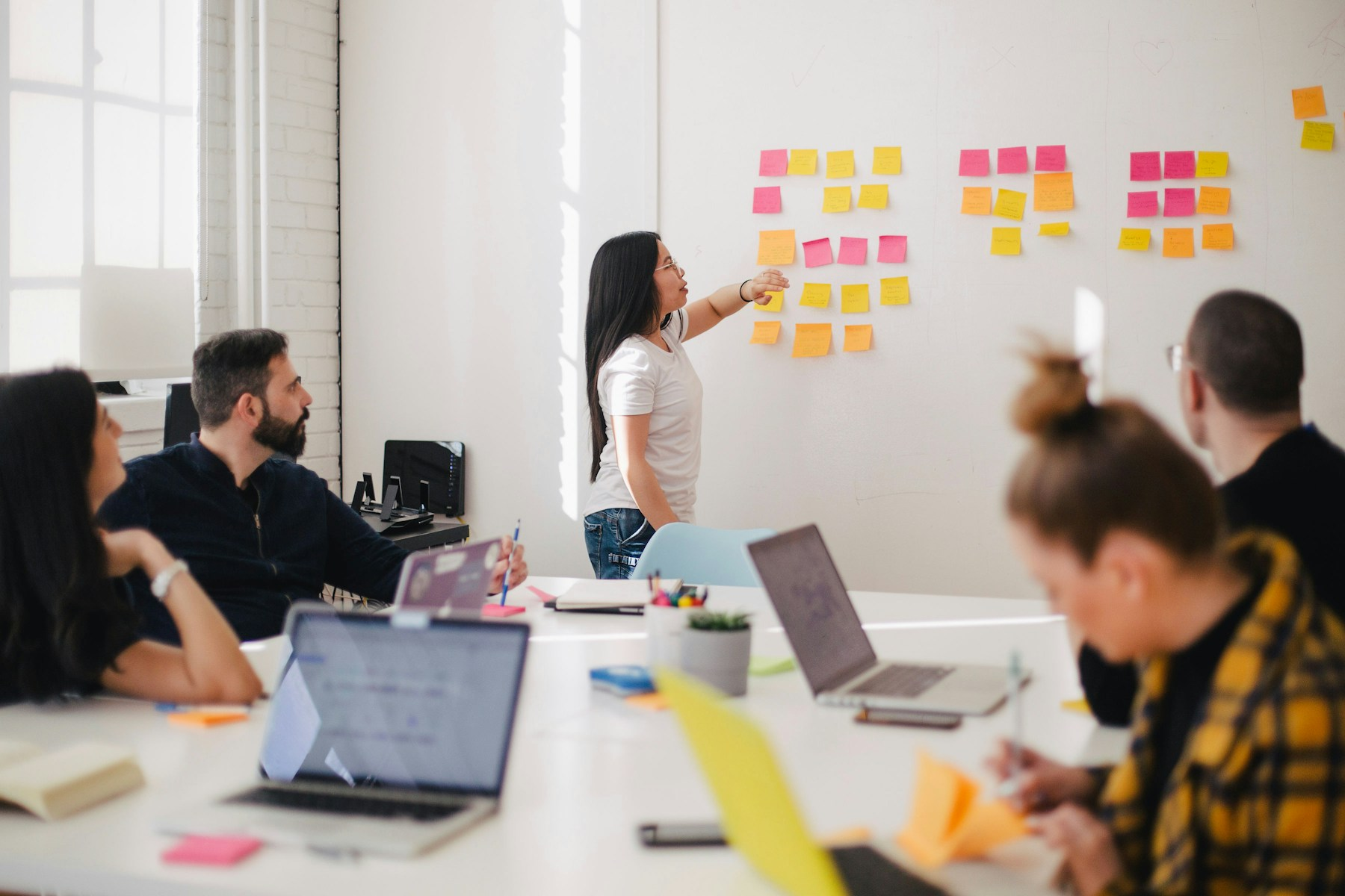 Marketing team collaborating in modern agency workspace