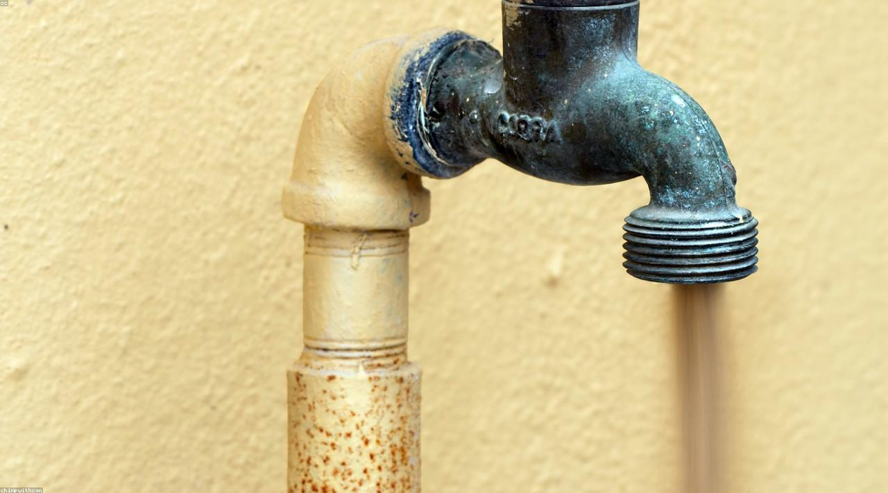 Plumbing technician inspecting a home water system