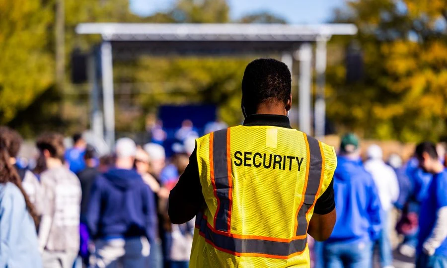 Event security staff managing crowd at venue