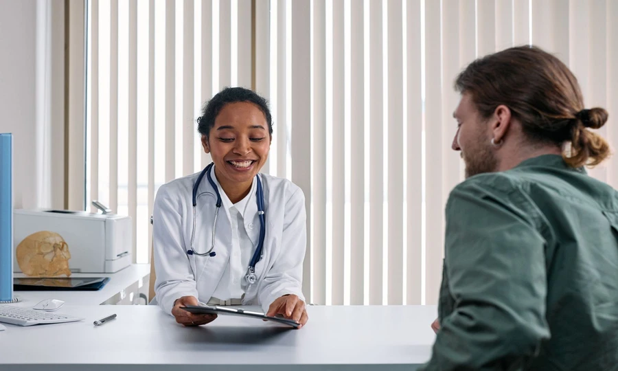 Female patient at a dermatology clinic consultation for professional skincare treatment