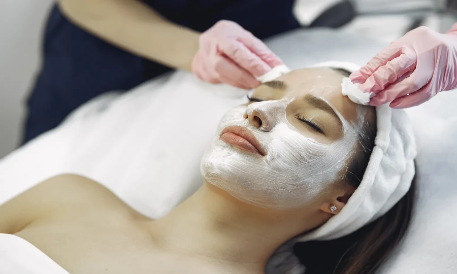 Woman relaxing at a luxury spa wellness center enjoying a calming beauty treatment