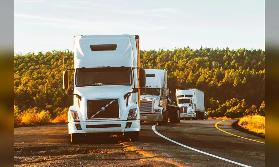 Semi truck on open road for trucking companies logo design