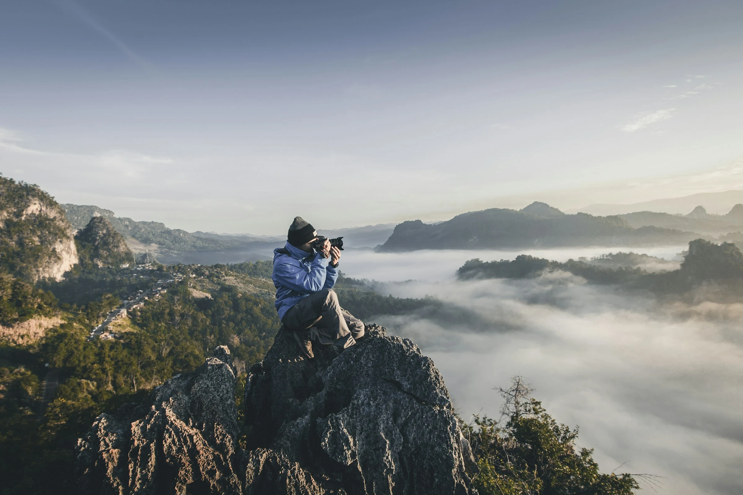 Professional videographer filming with cinema camera